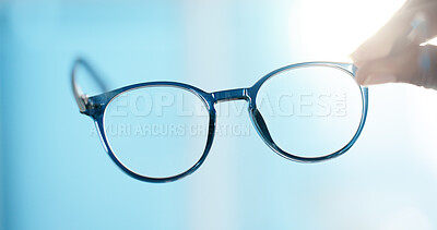 Buy stock photo Hand, glasses and closeup for lens, eye care and vision with prescription, POV and test at clinic. Person, optometry and spectacles for visual wellness, eyesight and view with optical assessment