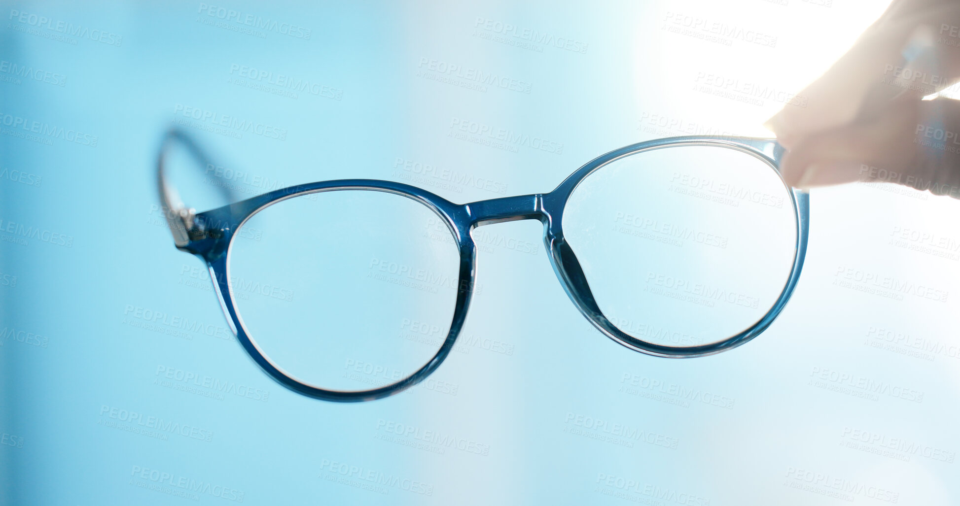 Buy stock photo Hand, glasses and closeup for lens, eye care and vision with prescription, POV and test at clinic. Person, optometry and spectacles for visual wellness, eyesight and view with optical assessment
