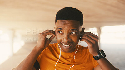 Buy stock photo Fitness, earphones and music with black man in city for workout podcast, streaming service and athlete. Exercise radio, wellness subscription and challenge with person outdoor for health and audio