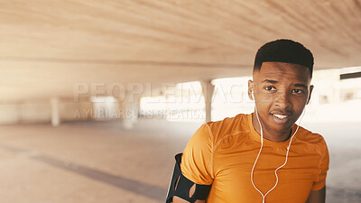 Buy stock photo Thinking, athlete and man with earphones, outdoor and break for training routine, healthy and music. Space, streaming and listen to audio with tech, black person and reflection for sport competition