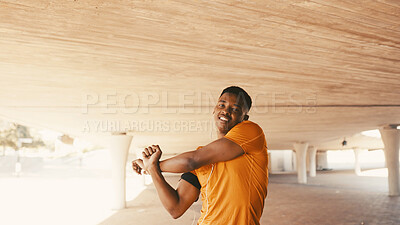 Buy stock photo Black man, portrait and stretching arms for fitness, warm up and earphones for cardio preparation. African person, smile and athlete for sports podcast, workout and getting ready for exercise outdoor