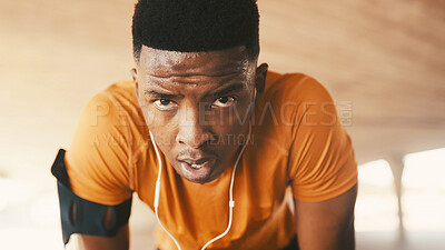 Buy stock photo Portrait, tired and black man with earphones for fitness, exercise recovery and streaming podcast. Fatigue, male person and sweat from cardio routine, sports workout and burnout with breathing break