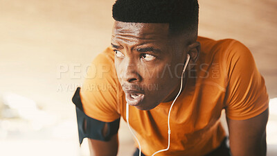 Buy stock photo Tired, black man or breathing with earphones for fitness, fatigue or intense training in city. Active, male person or rest with sweat for workout break, exercise or physical activity in an urban town