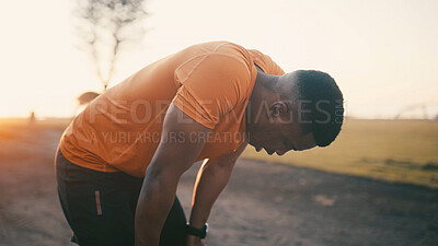Buy stock photo Tired, black man or breathing with break for fitness, fatigue or intense training in outdoor park. Active, male person or exhausted runner with sweat for workout rest or physical recovery in sunset