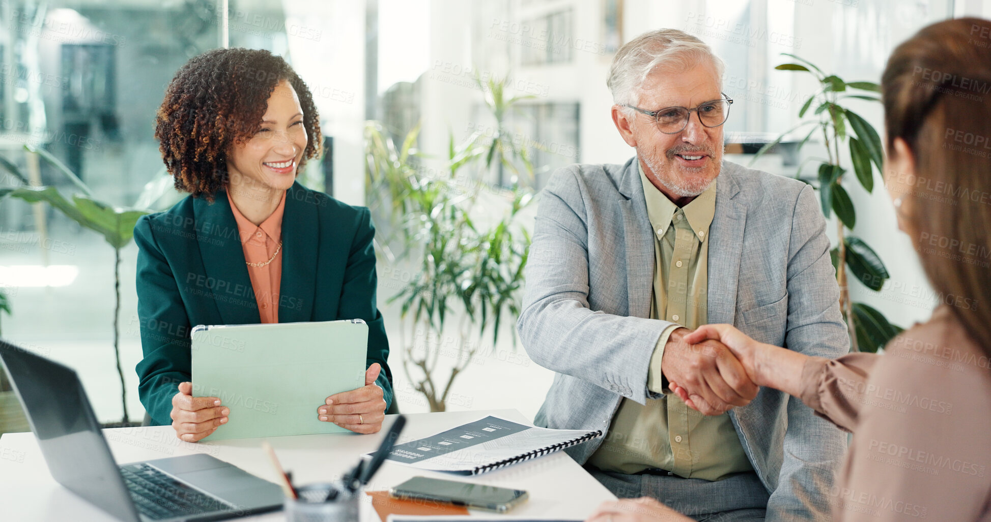 Buy stock photo Office, success and people in meeting, handshake and happy for collaboration with publicist or deal. Business, PR specialist and shaking hands with clients, achievement and agreement for partnership