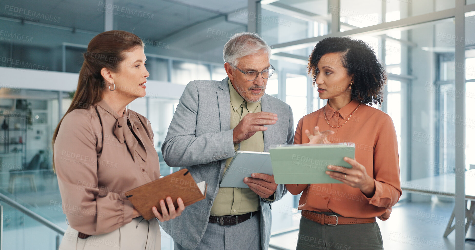 Buy stock photo Businessman, team and tablet with discussion at office, lobby and leader with review at media agency. People, group and tech with notes, talk and feedback for project, research or report at company