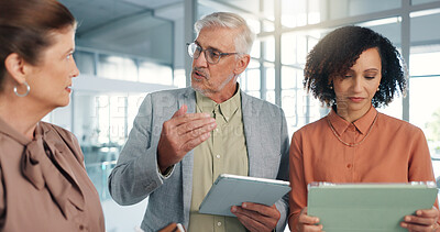 Buy stock photo Businessman, team and tablet with planning at office, lobby and leader with review at media agency. People, group and tech with notes, talk and feedback for project, strategy or report at company