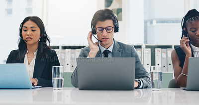 Buy stock photo Headset, laptop and support with business people in customer service office for financial consulting. Computer, feedback and finance with employee team at desk in call center for advice or help