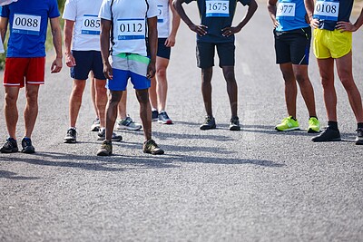 Buy stock photo Outdoor, sports and group of people for marathon, race competition and wellness challenge for fitness. Road, legs and athletes with waiting for running contest, triathlon and international tournament