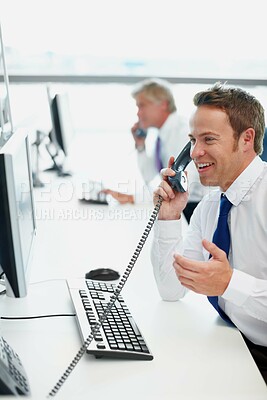 Buy stock photo Happy man, telephone and conversation in office, smile and speaking with client, happiness and info. Business people, employees and consultant in workplace, discussion and talking with computer