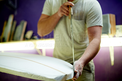 Buy stock photo Hands, man and carving surfboard with tools for custom design, shaping guide and repair work. Male person, cutting equipment and board with craft process, diy restoration and manufacturing precision