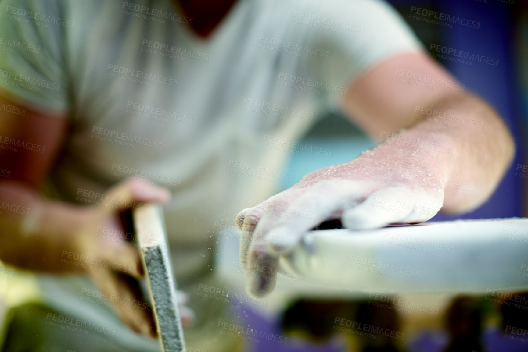 Buy stock photo Hands, person and sanding foam in workshop for surfing equipment, design process and handmade. Surfboard shaper, small business owner and sandpaper in garage for quality production and custom craft