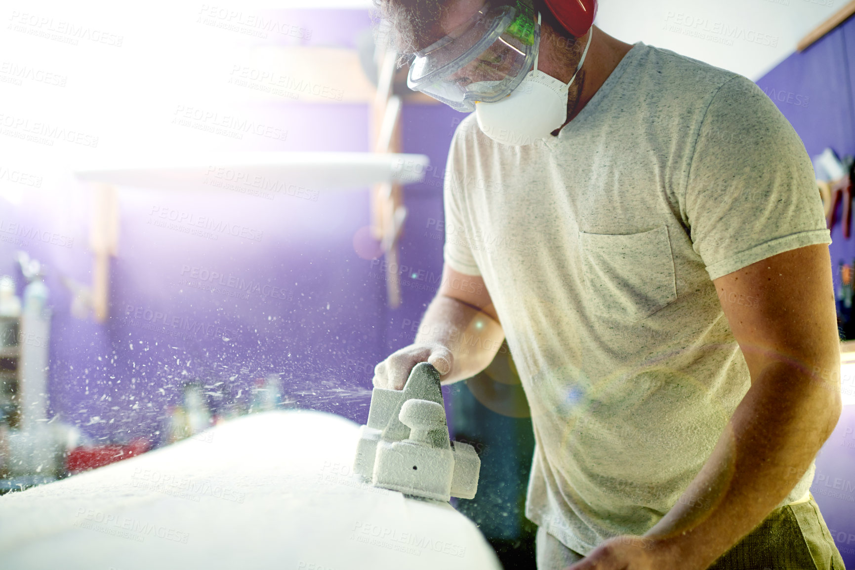 Buy stock photo Creative, man and foam with sanding, surfboard and tools for skills, talent and hobby. Workshop, artist and entrepreneur with craftsman for design manufacturing and custom work for artisan craft