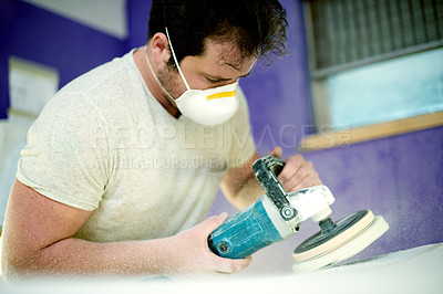 Buy stock photo Grinder, man and artisan in workshop for design, shape or refurbishing surfboard for small business. Industry, male person and industrial worker with tool for creation, manufacturing and polishing.