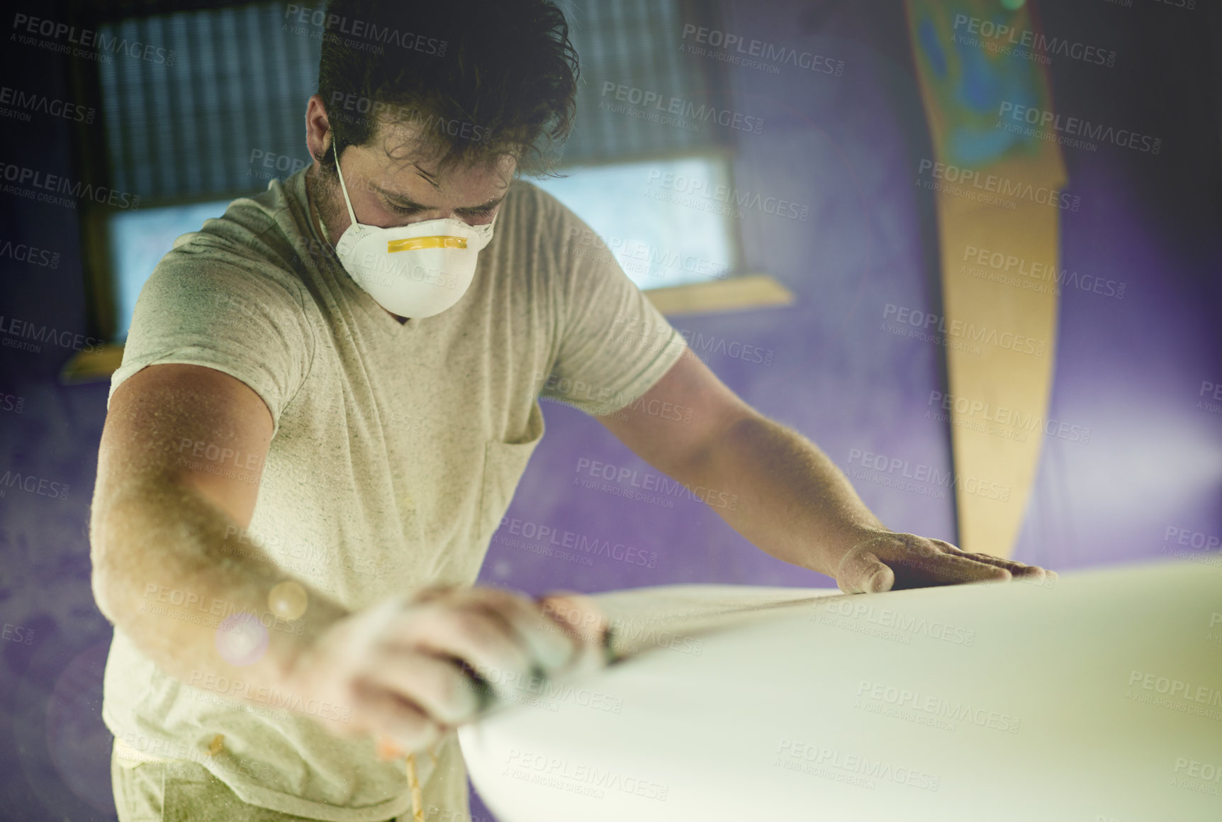 Buy stock photo Surfboard, man and sanding in workshop for manufacturing, design or polish. Surf, person and tools to shape blank with block, smooth and production process with dust on foam for creative handcraft