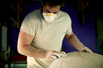 Buy stock photo Surfboard, man and shape in workshop for manufacturing, design or polish. Surf, person and tools for sanding blank with block, smooth and production process with dust on foam for bespoke handcraft