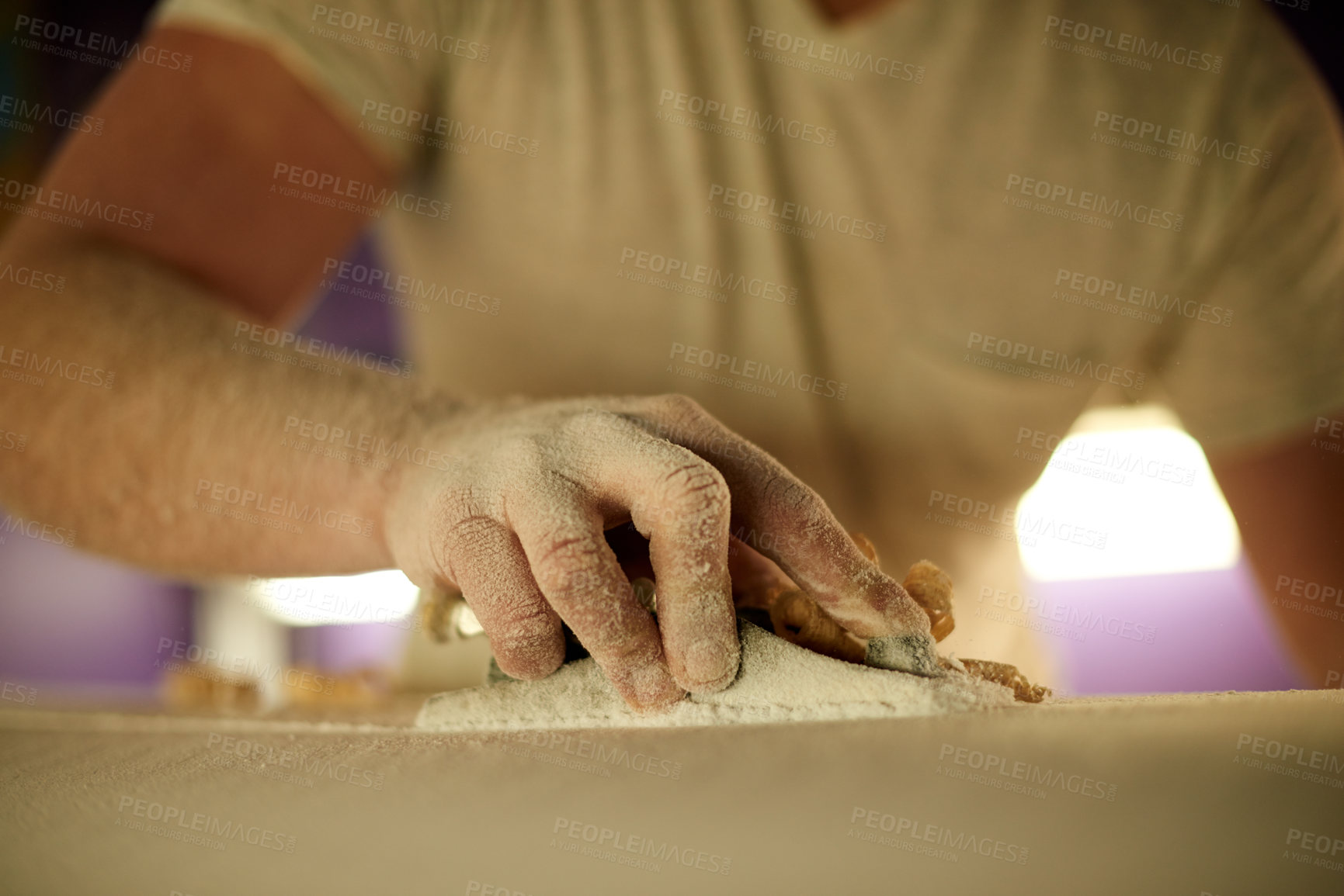 Buy stock photo Surfboard, hands and shape in workshop for production, bespoke design or polish. Surf, person and tools for sanding blank, smooth and manufacturing process with dust on foam for creative handcraft