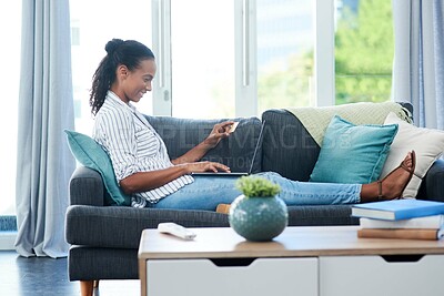 Buy stock photo Relax, laptop and African woman with credit card on sofa for transaction, e commerce or online shopping in living room. Payment, app and person for purchase, subscription or internet banking in home