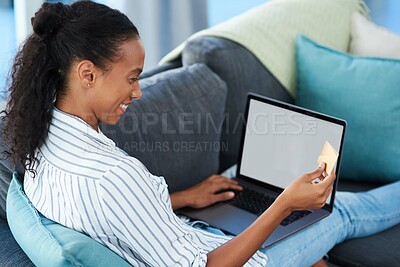 Buy stock photo Screen, laptop and African woman with credit card on sofa for transaction, e commerce or online shopping in living room. Mockup, app and person for purchase, subscription or internet banking in home