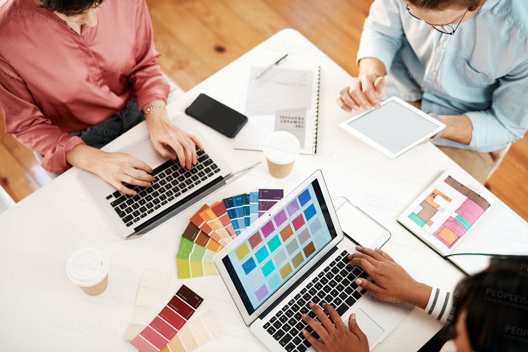 Buy stock photo Creative, designers and meeting with color swatches above for web, interior design or project at office. Top view, employees or team planning with laptop, tablet or technology for colorful palette