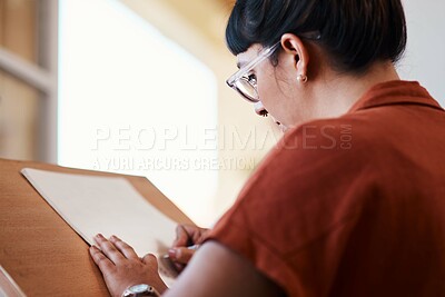 Buy stock photo Artist, drawing and learning on paper in studio process of creativity at college with project. Art, student and woman planning sketch with pencil on board in university workshop with talent or skill