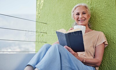 Buy stock photo Senior woman, portrait and book in retirement for relax, learning and wellness in morning on weekend. Elderly person, coffee and reading on balcony of home for peace, storytelling and hobby with cup