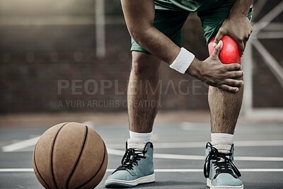 Buy stock photo Sports, injury in basketball and knee pain or athlete man while on an outdoors court holding his hurt leg during training or exercise for hobby. Closeup of male hands on glowing red body part