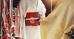 Hands, woman and size to tailor waist for fashion, dress maker and kimono fitting in boutique. People, designer and style clothing for culture tradition in Japan, fabric check and closeup of helping 