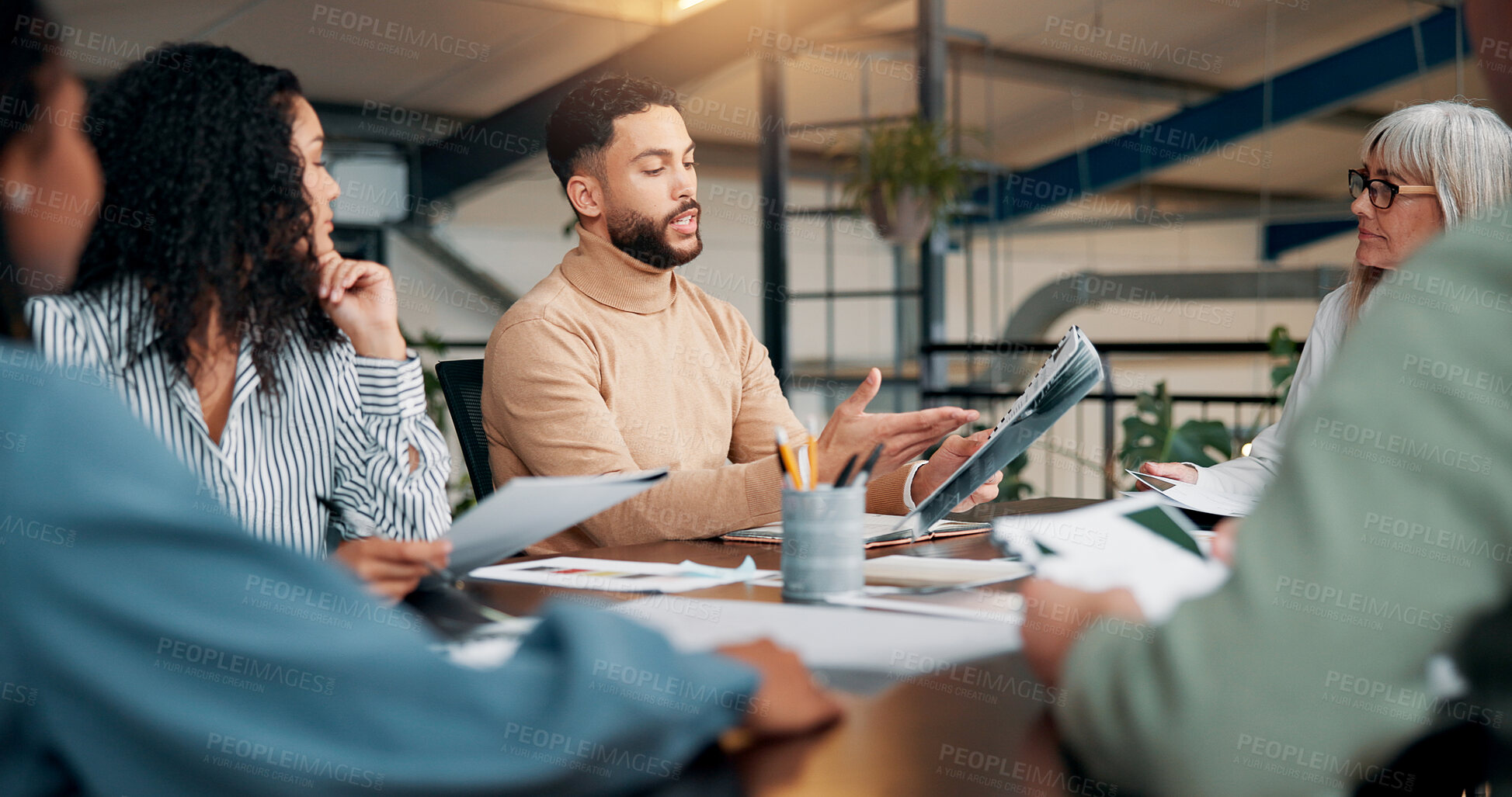 Buy stock photo Portfolio, talking or designers in meeting in agency for creative project, startup or feedback. Review, interior design paperwork and people with teamwork for brainstorming, planning or collaboration
