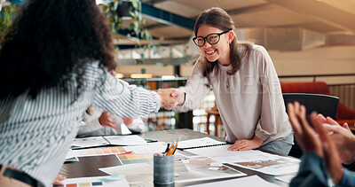 Buy stock photo Interior designer, people and shaking hands with partnership in office for renovation contract, deal or b2b onboarding. Applause, documents or client with handshake for design proposal pitch or offer