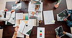 Creative, documents and above of business people in meeting for project ideas, research and discussion. Design agency, office and workers with paperwork for teamwork, collaboration and brand strategy