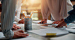 Planning, creative and hands of business people in meeting for project ideas, research and discussion. Design agency, office and workers with paperwork for teamwork, collaboration and brand strategy