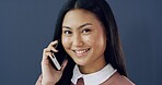 Business, phone call and portrait of woman in studio for conversation, negotiation or networking. Communication, contact and smile of Asian employee isolated on blue background for mobile update