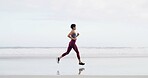 Woman, running and fitness at beach, shore or training with space, sky or outdoor for routine. Person, workout and exercise for wellness, cardio challenge and jog by ocean with profile in New Zealand