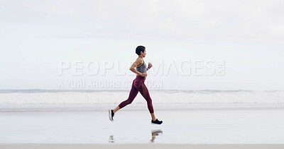 Buy stock photo Woman, running and fitness at beach, shore or training with space, sky or outdoor for routine. Person, workout and exercise for wellness, cardio challenge and jog by ocean with profile in New Zealand