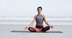 Woman, meditation and lotus at beach, breathing and mindfulness with space, sky and zen in summer. Person, eyes closed and yoga on ground with mat, nature and outdoor by ocean on vacation in Portugal