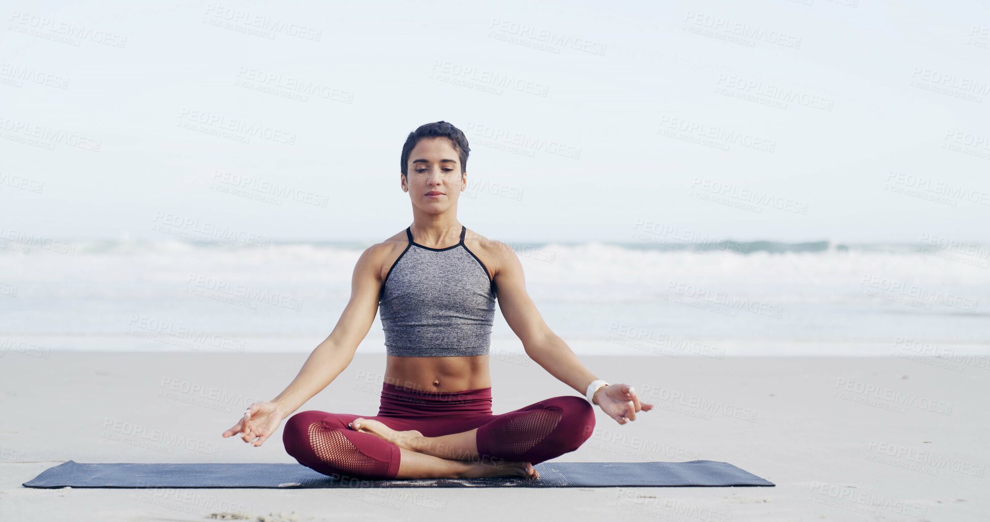 Buy stock photo Woman, meditation and lotus at beach, peace and mindfulness with space for breathing exercise. Person, eyes closed and yoga on ground with mat, nature and outdoor by ocean on vacation in Portugal