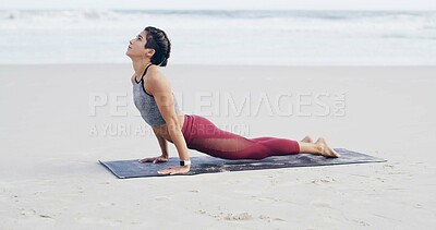 Buy stock photo Beach, stretching and woman on mat, yoga or flexibility for muscle strength, awareness and wellness. Outdoor, upward facing dog and person with routine for fitness, space and balance in nature or sea