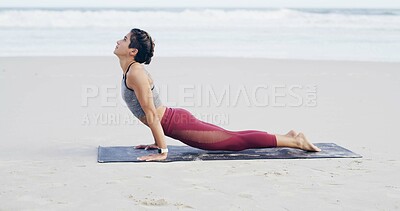 Buy stock photo Beach, stretching and woman on mat, awareness or flexibility for muscle strength, yoga and wellness. Outdoor, upward facing dog and person with routine for fitness, space and balance in nature or sea