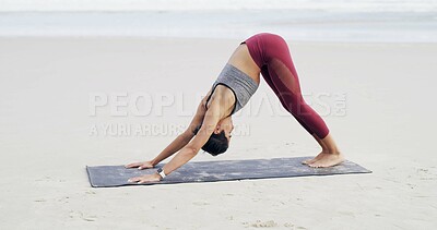 Buy stock photo Woman, stretching and yoga for flexibility, beach or fitness with routine, balance or spinal health. Outdoor, downward facing dog and person on mat for warm up, wellness and space in nature or sea