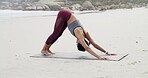 Woman, stretching and yoga for fitness, beach or flexibility with routine, balance or spinal health. Outdoor, downward facing dog and person on mat for warm up, wellness and space in nature or sea