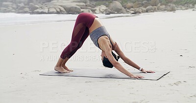 Buy stock photo Woman, stretching and yoga for fitness, beach or flexibility with routine, balance or spinal health. Outdoor, downward facing dog and person on mat for warm up, wellness and space in nature or sea