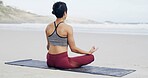 Lotus pose, meditation and back of woman on beach with peace, mindfulness and zen for breathing. Namaste, balance and female person with yoga for wellness, health and exercise on mat by ocean.