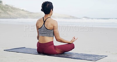 Buy stock photo Lotus pose, meditation and back of woman on beach with peace, mindfulness and zen for breathing. Namaste, balance and female person with yoga for wellness, health and exercise on mat by ocean.