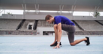 Buy stock photo Man, athlete and ready with start line on stadium track for sprint, race or training lap. Active, male person or  runner in preparation with begin for sport competition, distance running or fitness