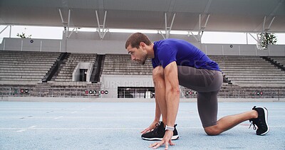 Buy stock photo Man, athlete and preparation with start line on stadium track for sprint, race or training lap. Active, male person or runner getting ready to begin for sport competition, distance running or fitness