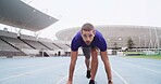 Man, runner and challenge with start line on stadium track for sprint, race or training lap. Active, male person or athlete getting ready to begin for sport competition, distance running or fitness