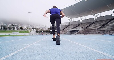 Buy stock photo Man, back or runner with start on stadium track for sport race, sprint or fitness training. Active, male person or athlete with launch, begin or practice for competition, speed challenge or athletics