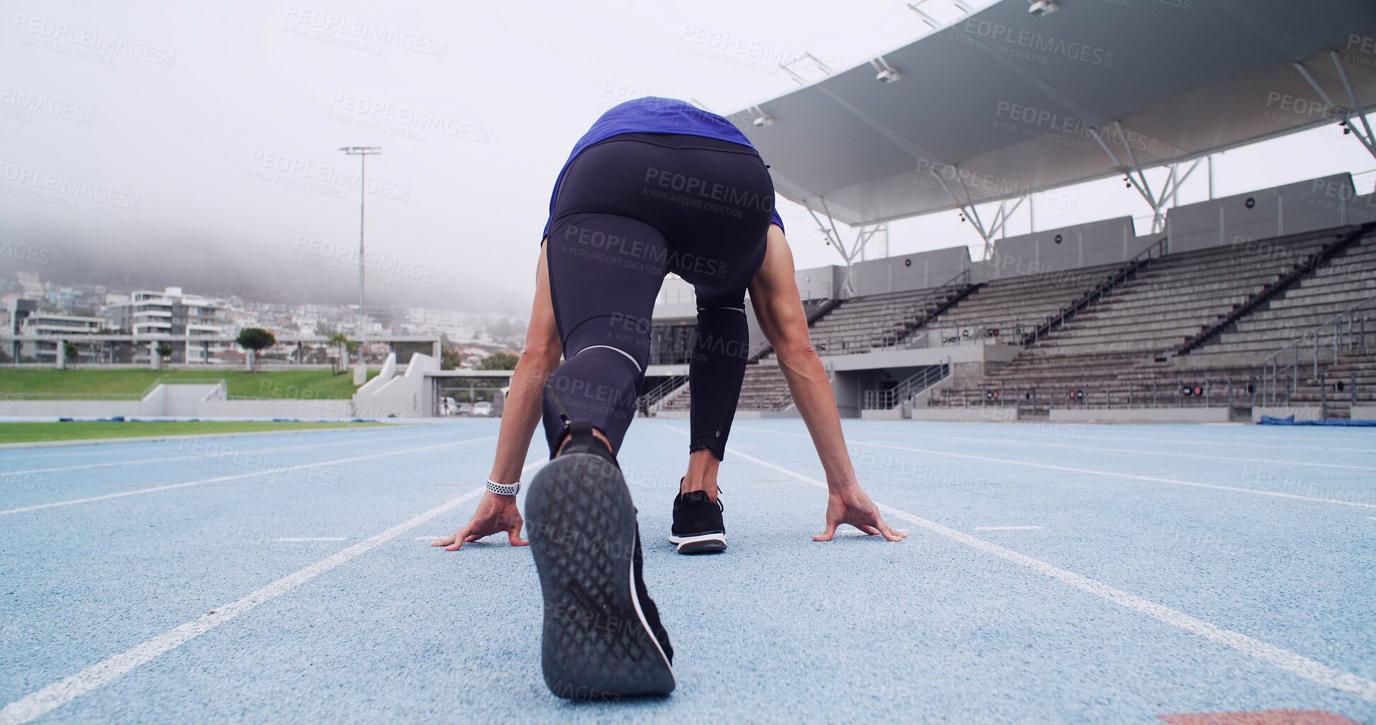 Buy stock photo Runner, back of man and ready on track to start workout, marathon training and cardio at stadium. Athlete, set and running take off for competition fitness, endurance exercise and sports performance
