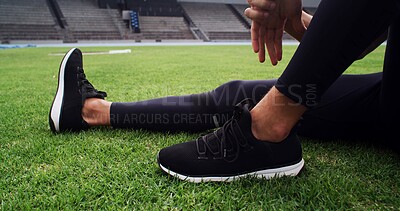 Buy stock photo Exercise, hands and shoes with person on grass in stadium for start of competition or tournament. Fitness, getting ready and sneakers with athlete or runner outdoor on field for sports event closeup